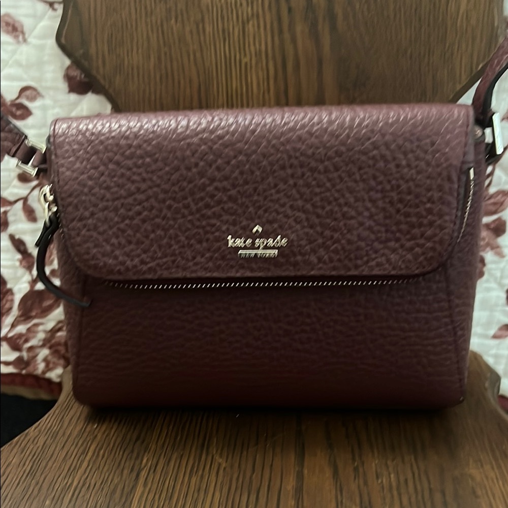 Kate Spade Burgundy Textured Leather Crossbody Bag with Flap Closure